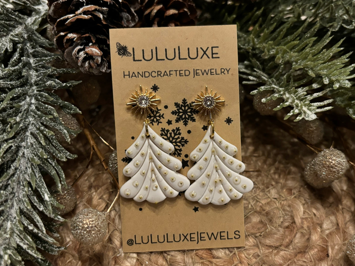 White Christmas Trees with gold ornaments